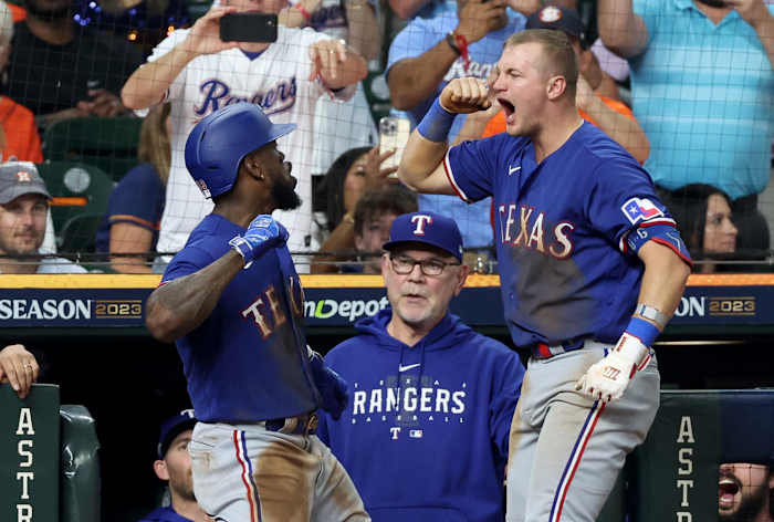 Adolis Garcia, left, celebrates with Josh Jung after hitting a home run in the third inning of Game 7 of the ALCS Monday night at Minute Maid Park in Houston. The Texas Rangers beat the Houston Astros to advance to their first World Series since 2011.